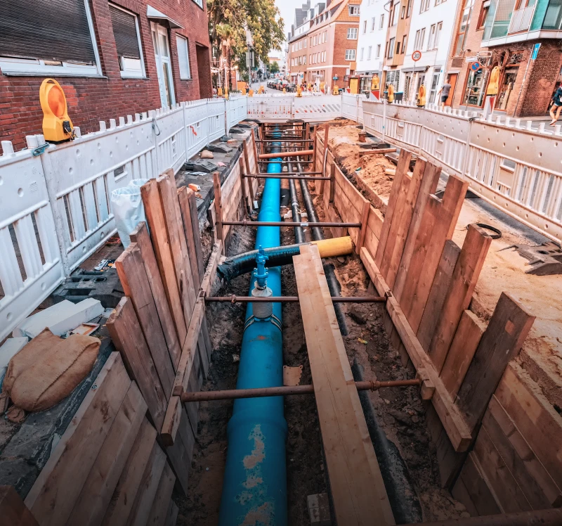 Urban street excavation with wooden barriers